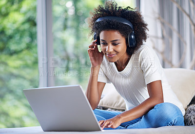 Buy stock photo Black woman, headphones and laptop at home for online teaching, e learning and education in living room. Female person, scholar and university student in house for remote class, studying and tuition