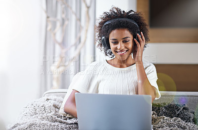 Buy stock photo African, woman and laptop with smile, headphones and technology for video and music. Student, computer and internet for streaming, blog or email with connectivity and relaxation for wellness in house