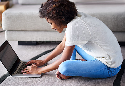 Buy stock photo Happy, laptop and portrait of woman on floor working on freelance creative project in living room. Smile, technology and African female designer typing on computer for research on rug in apartment.