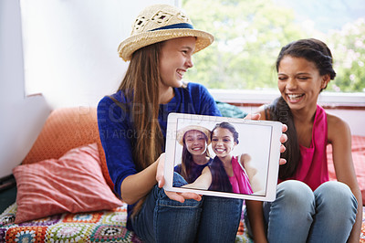 Buy stock photo Happy kids, tablet screen and photo with friends in home, laughing and social media selfie. Tech, girls and show profile picture in house with teenager for funny memory, capture moment and bonding