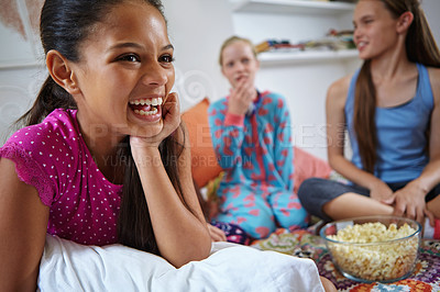 Buy stock photo Shot of a group of young friends enjoying a sleepover