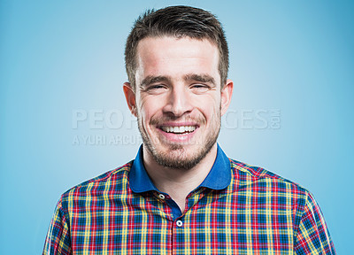 Buy stock photo Studio portrait of a handsome young man wearing a trendy button down shirt