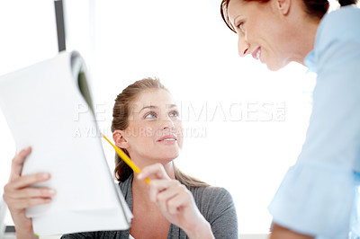 Buy stock photo A young professional sharing her ideas with a colleague