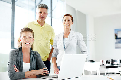 Buy stock photo Portrait of a successful team of professionals in casual wear in an office setting