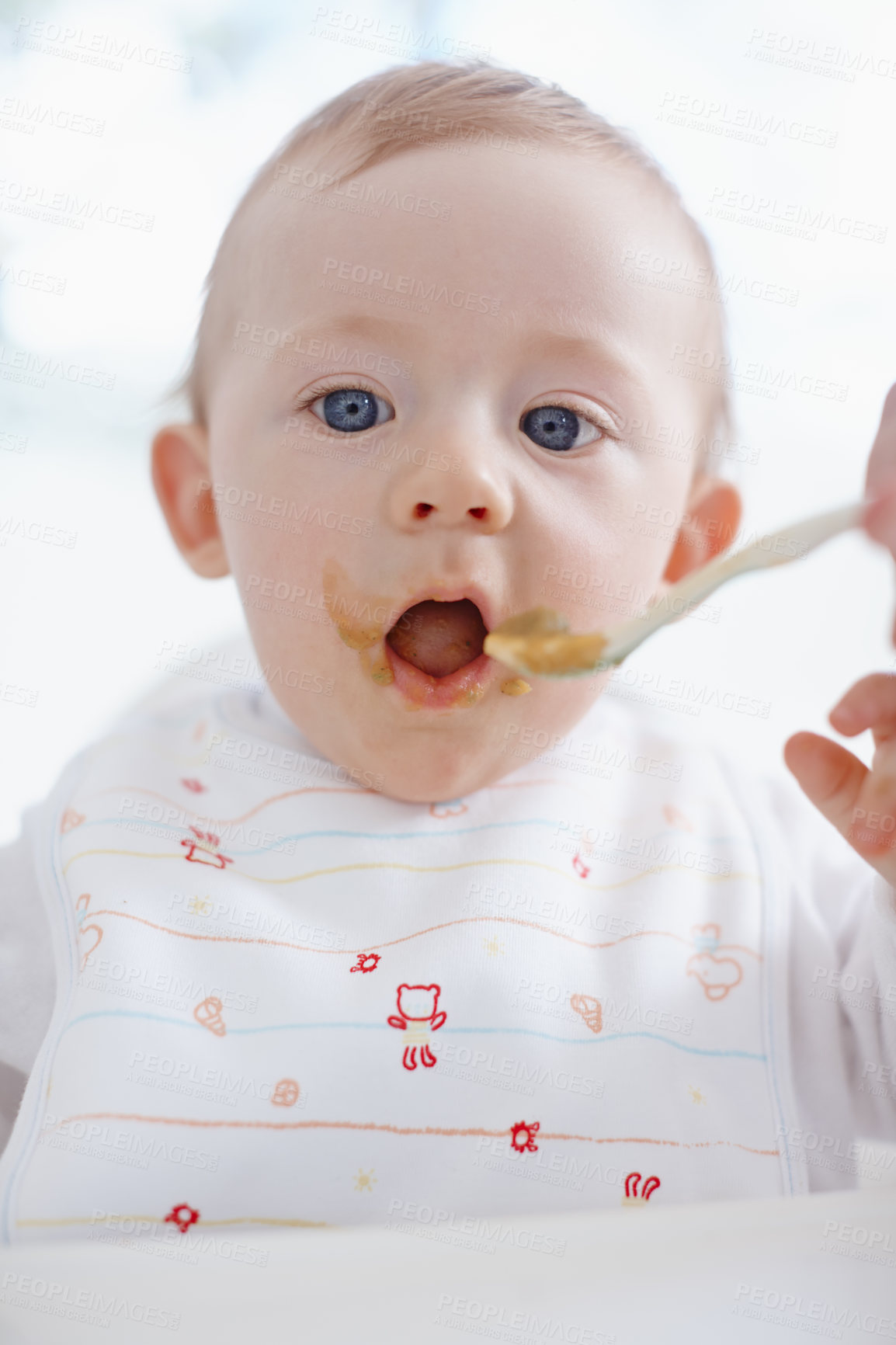 Buy stock photo Closeup of a cute baby boy opening his mouth for his mother to feed him