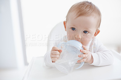 Buy stock photo Baby, bottle and water nutrition in home, drinking and formula for child growth development. Infant, high chair and beverage for healthy vitamins in diet, motor skills and learning to hold container