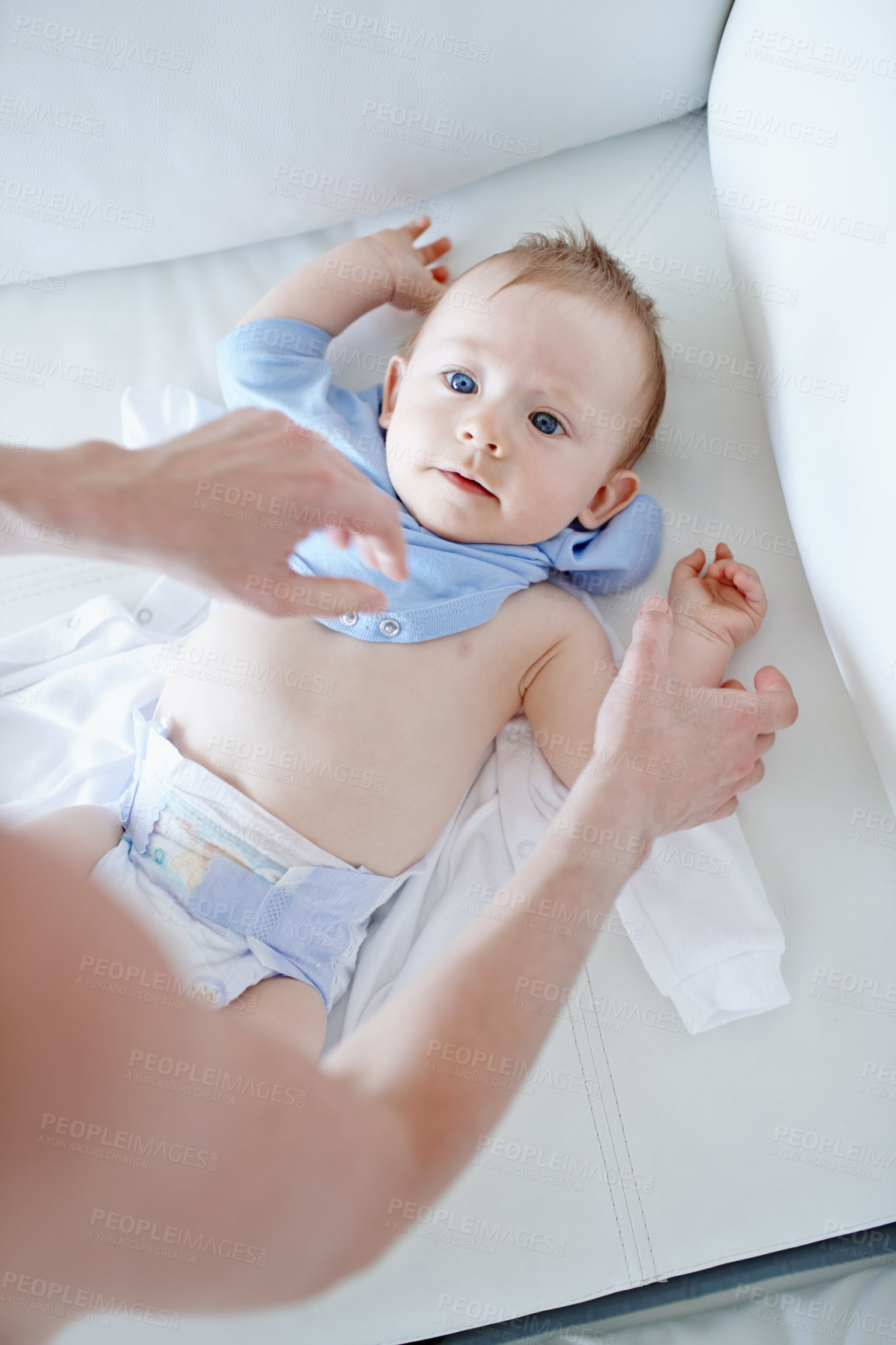 Buy stock photo Nursery, hands and parent with baby to change, clothes hygiene and health with routine at home. Above, infant boy or mother with child care for dressing, bonding or connection for motherhood in house