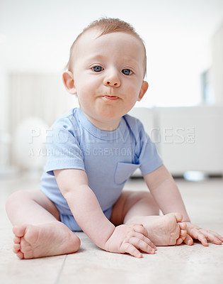 Buy stock photo A baby boy sitting on the living room floor