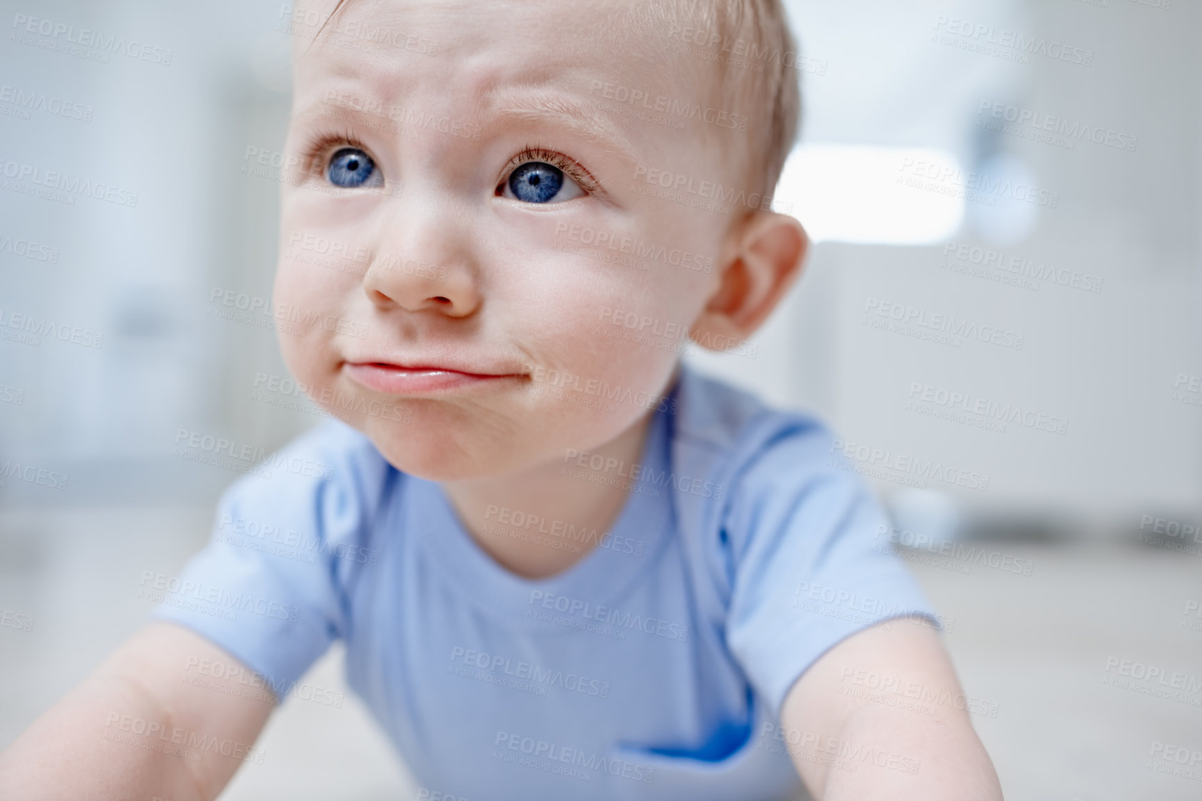 Buy stock photo Closeup of a baby boy pulling a sad face