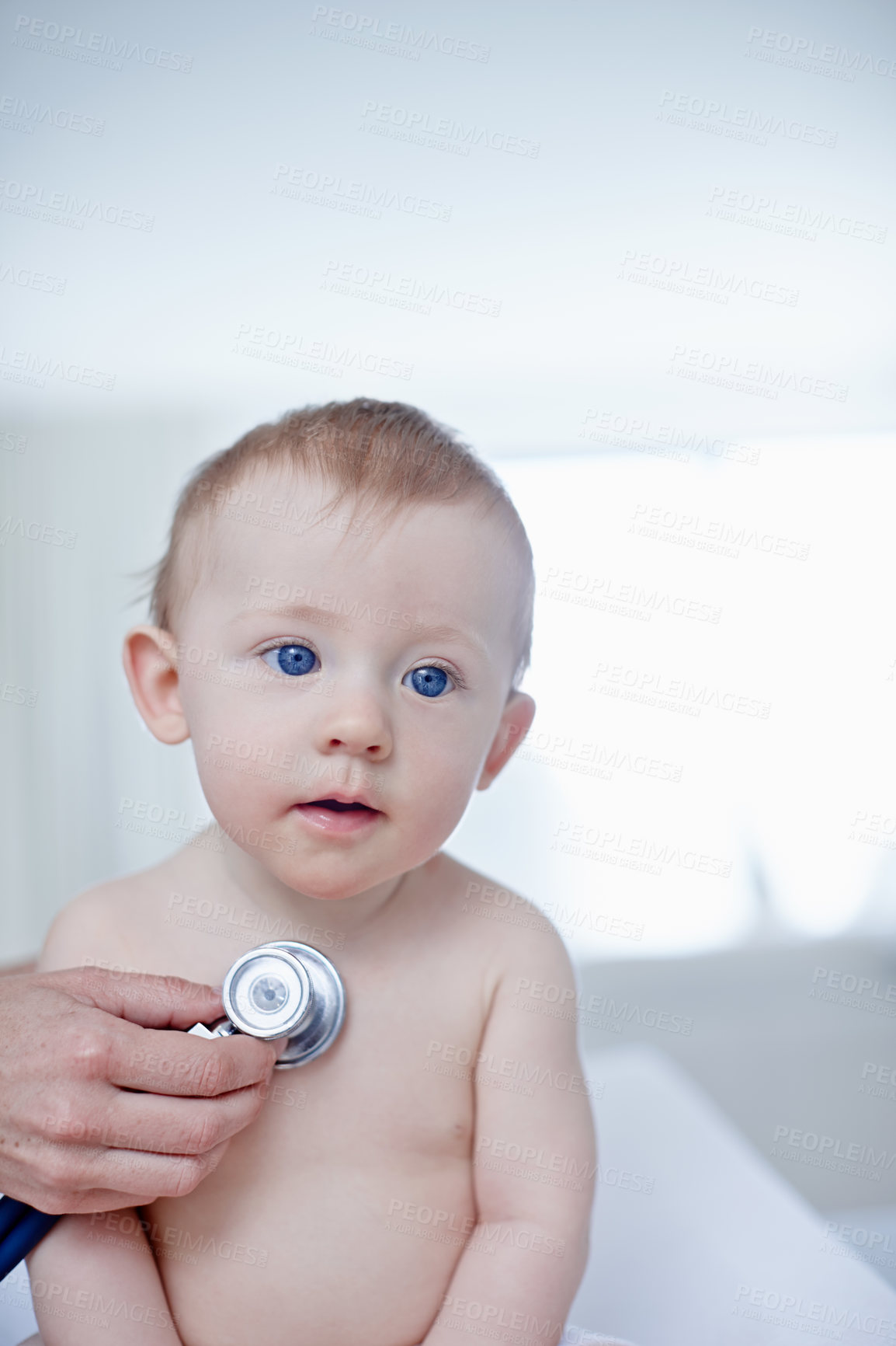 Buy stock photo A baby boy getting examined by a doctor