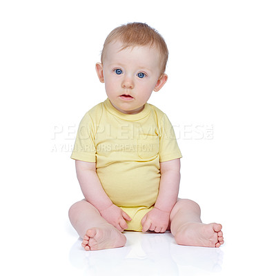 Buy stock photo Studio shot of a cute baby boy sitting on the floor