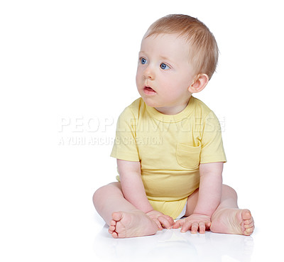 Buy stock photo Studio shot of a cute baby boy sitting on the floor