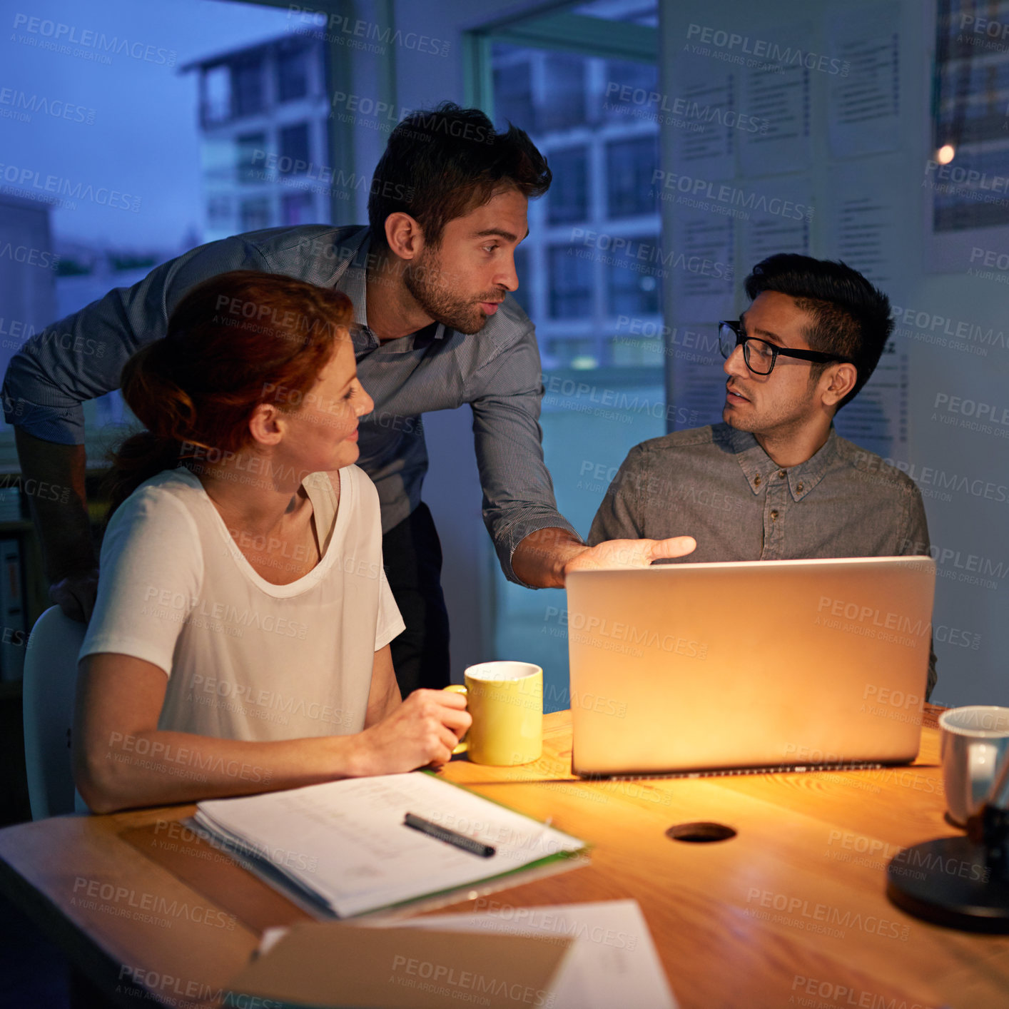 Buy stock photo Planning, night and a business team on a laptop, working in the boardroom for teamwork, strategy or innovation. Meeting, strategy or overtime with a group of employees at work together in the evening