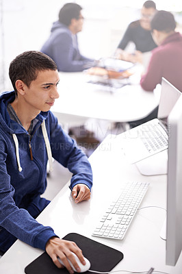 Buy stock photo Young man, computer and working at office desk for web development, programming or information technology. Business programmer, worker or online designer on multimedia, planning and startup project