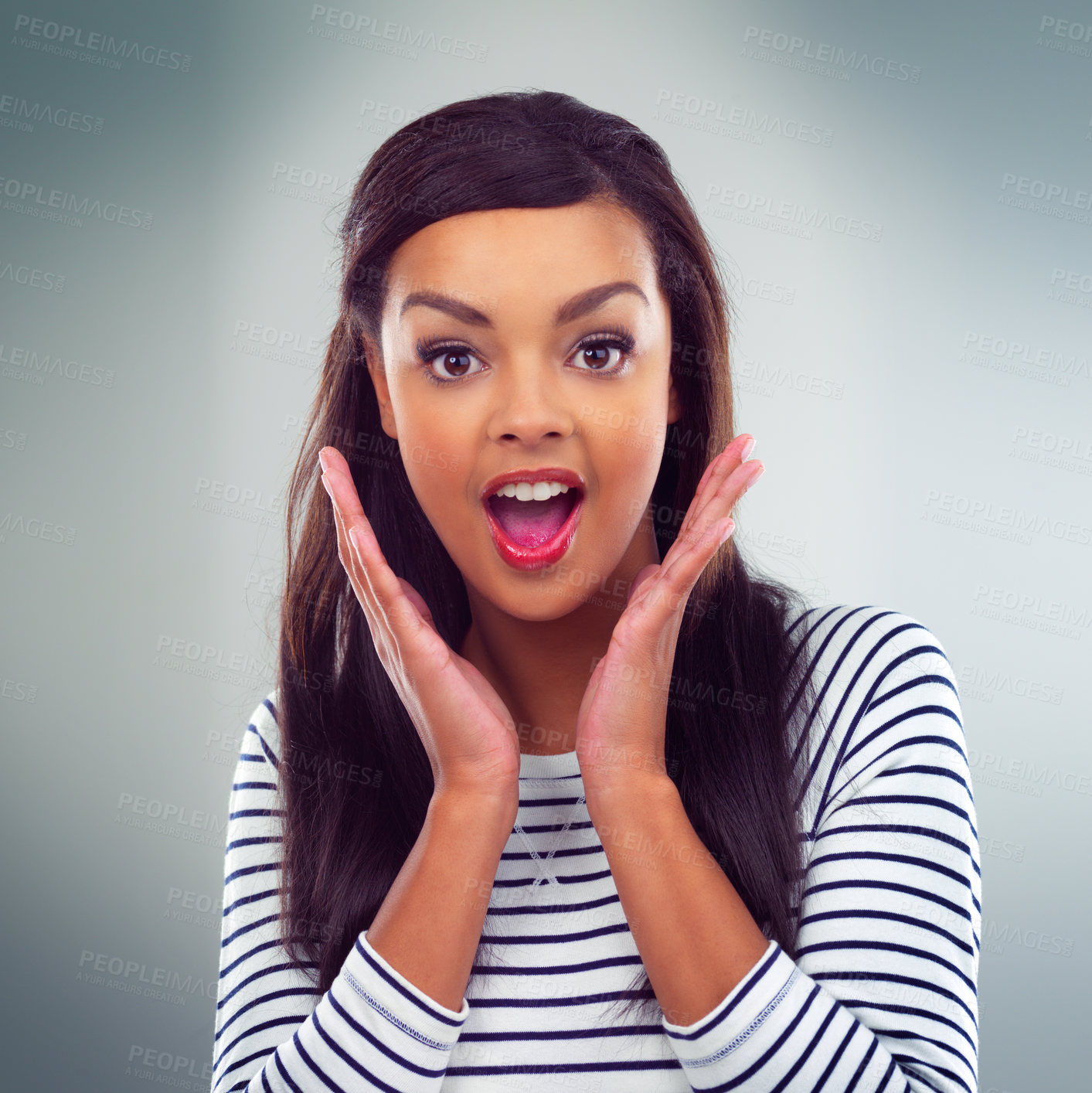 Buy stock photo Studio shot of a young woman posing against a grey background