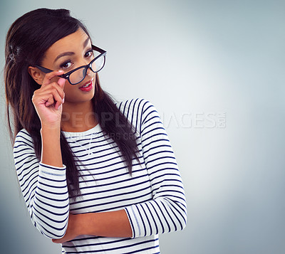 Buy stock photo Studio shot of a young woman posing against a grey background