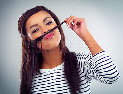 Buy stock photo Portrait, woman and expression in studio, mustache and hands isolated on gray background. Emoji, comedy and haircare for confident female model, humor or beauty with silly or goofy face for texture