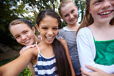 Buy stock photo Shot of a group of young girl friends taking a selfie together outside