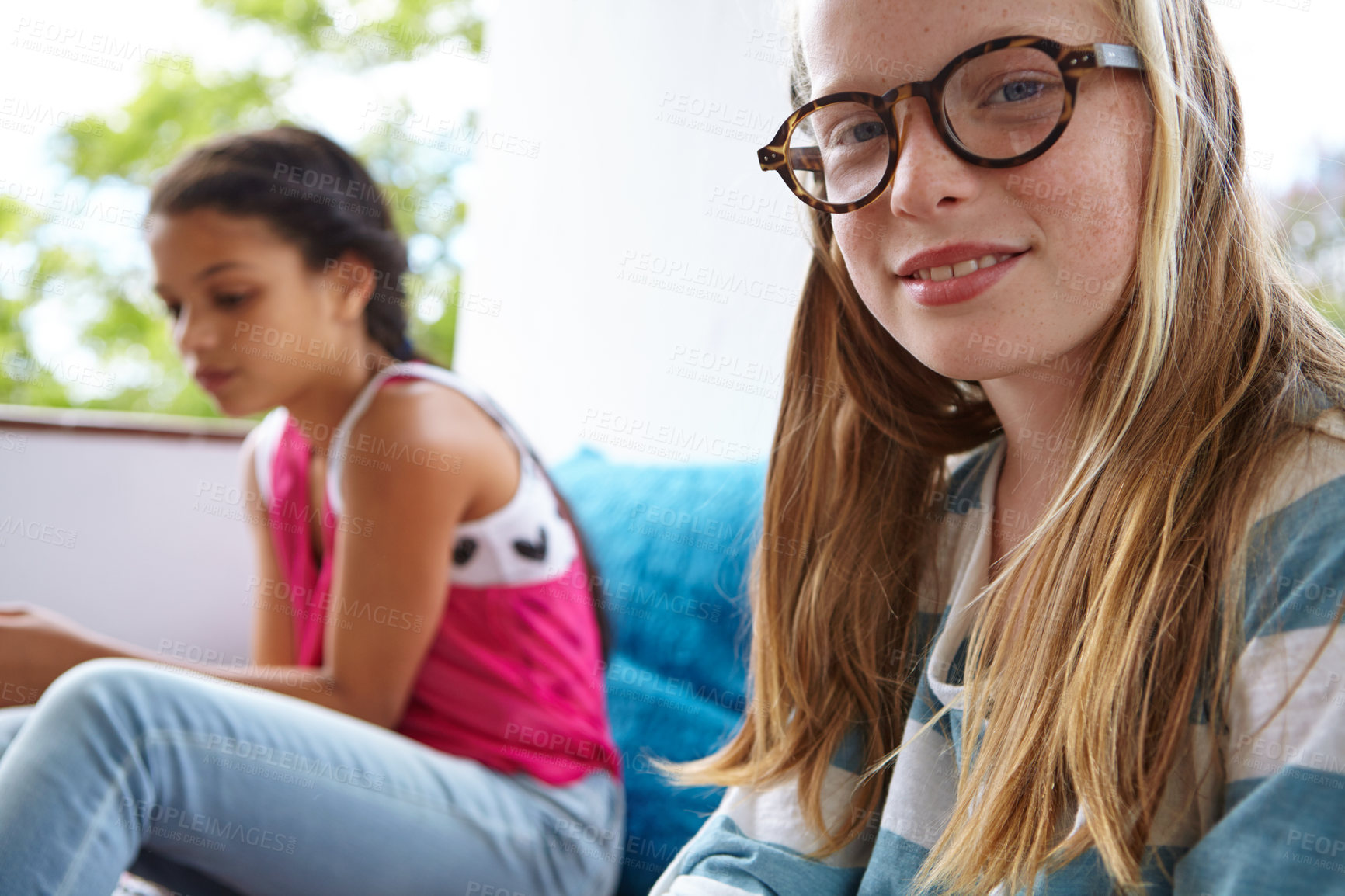 Buy stock photo Shot of two teenage friends hanging out indoors