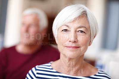 Buy stock photo Portrait of a senior woman with her husband in the background