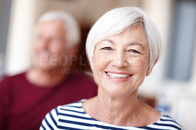 Buy stock photo Portrait of a happy senior woman with her husband in the background