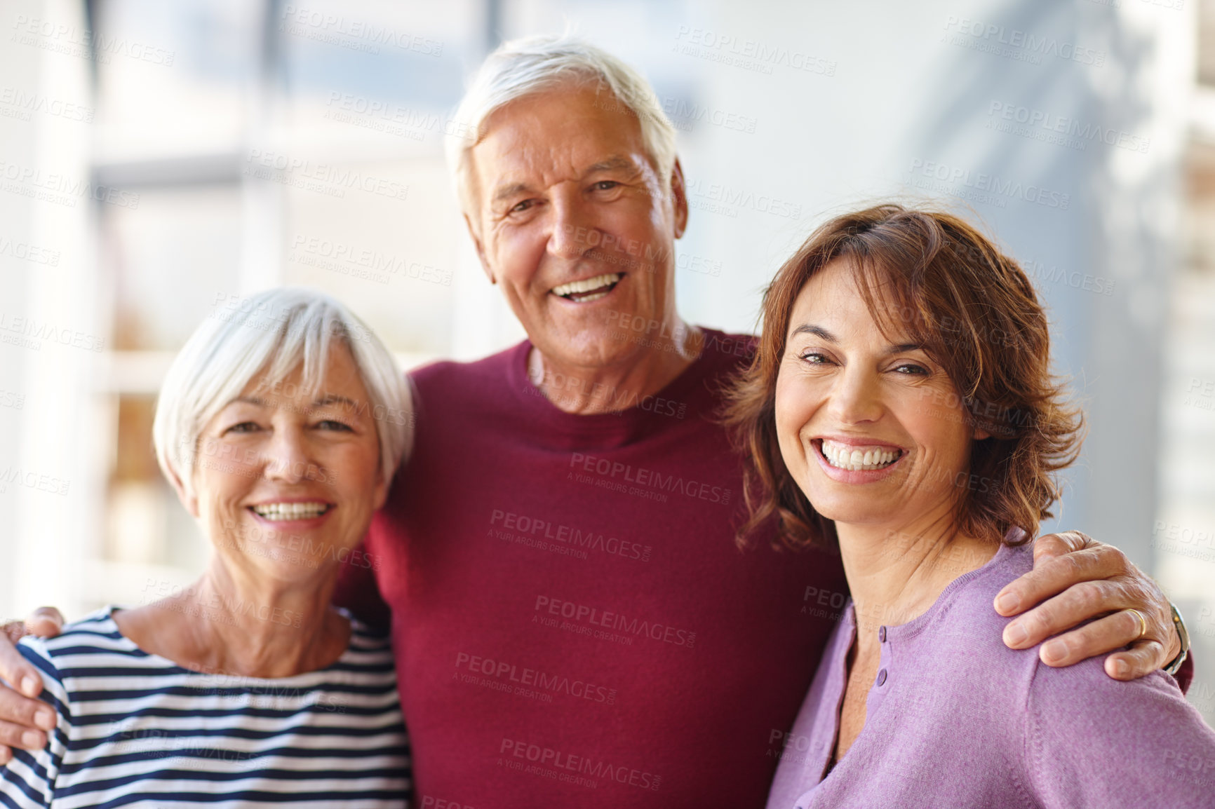 Buy stock photo Portrait of a senior man standing beside his wife and daughter