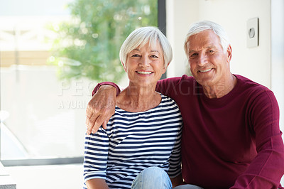 Buy stock photo Portrait of a senior couple sitting together at home