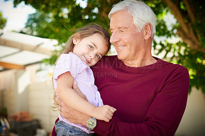 Buy stock photo Cropped shot of a senior man bonding with his granddaughter