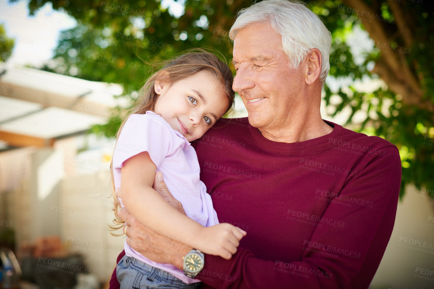 Buy stock photo Cropped shot of a senior man bonding with his granddaughter