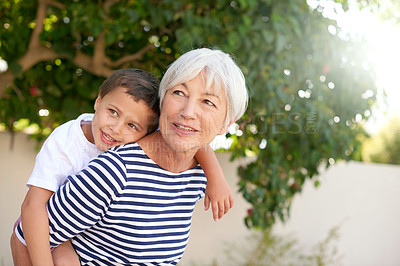 Buy stock photo Cropped shot of a senior woman bonding with her grandson