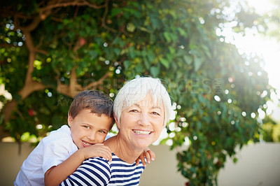 Buy stock photo Portrait, grandmother and piggyback child in garden or bonding, together or quality time in backyard or fun on summer vacation. Family, senior woman or happy retirement with love, kid and hug or game