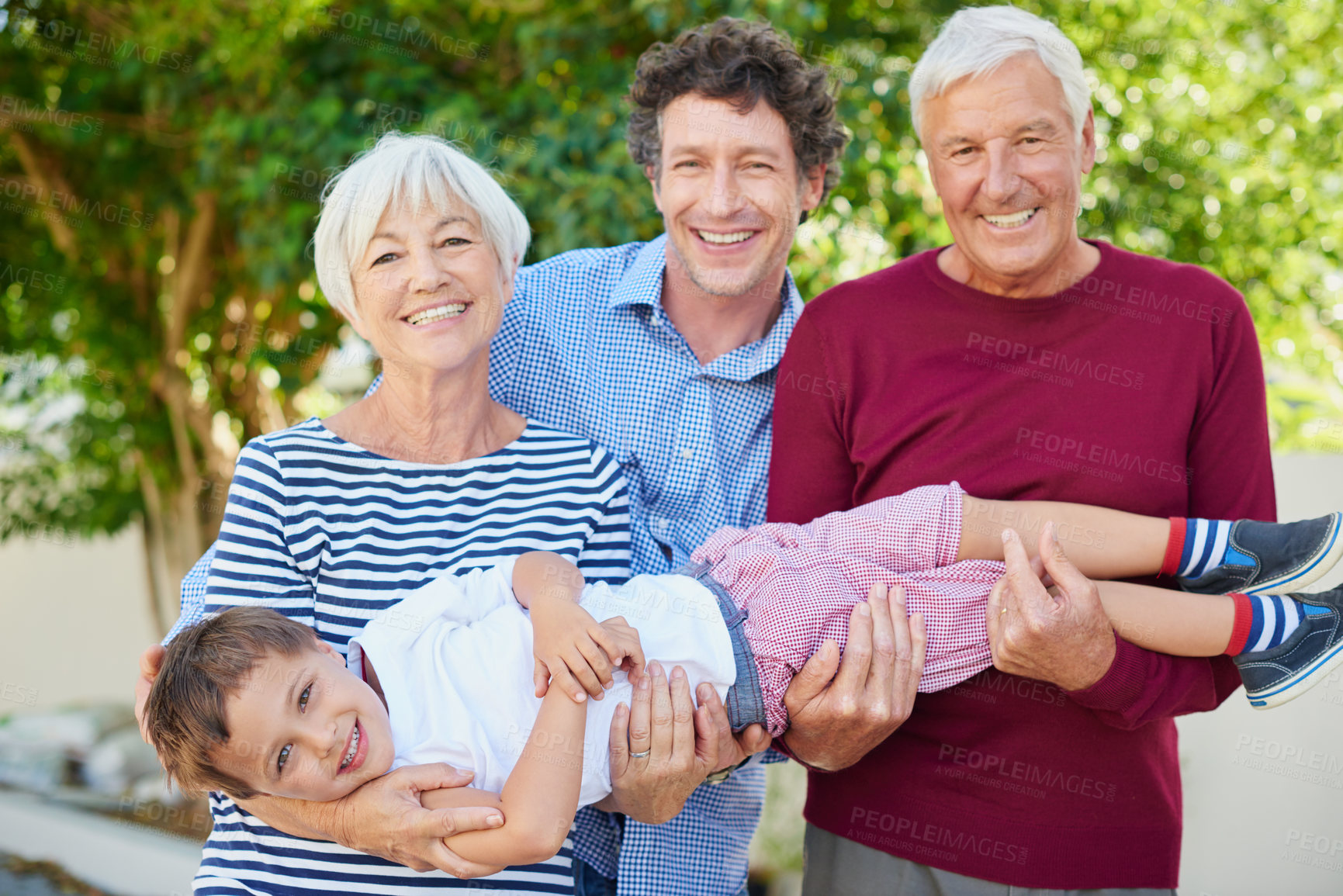 Buy stock photo Cropped portrait of a multi-generational family spending time together outside