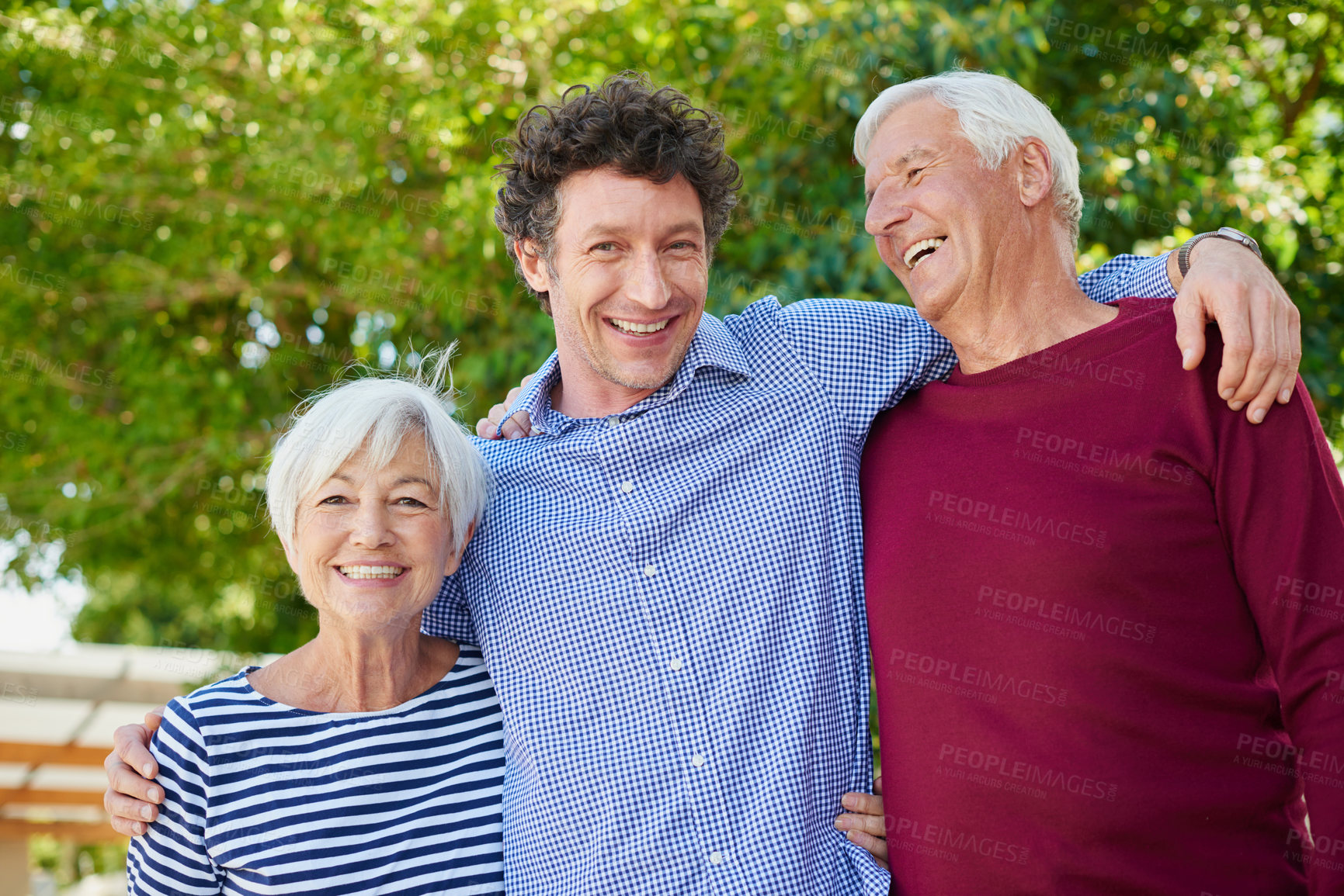 Buy stock photo Cropped portrait of a senior couple standing outside with their son