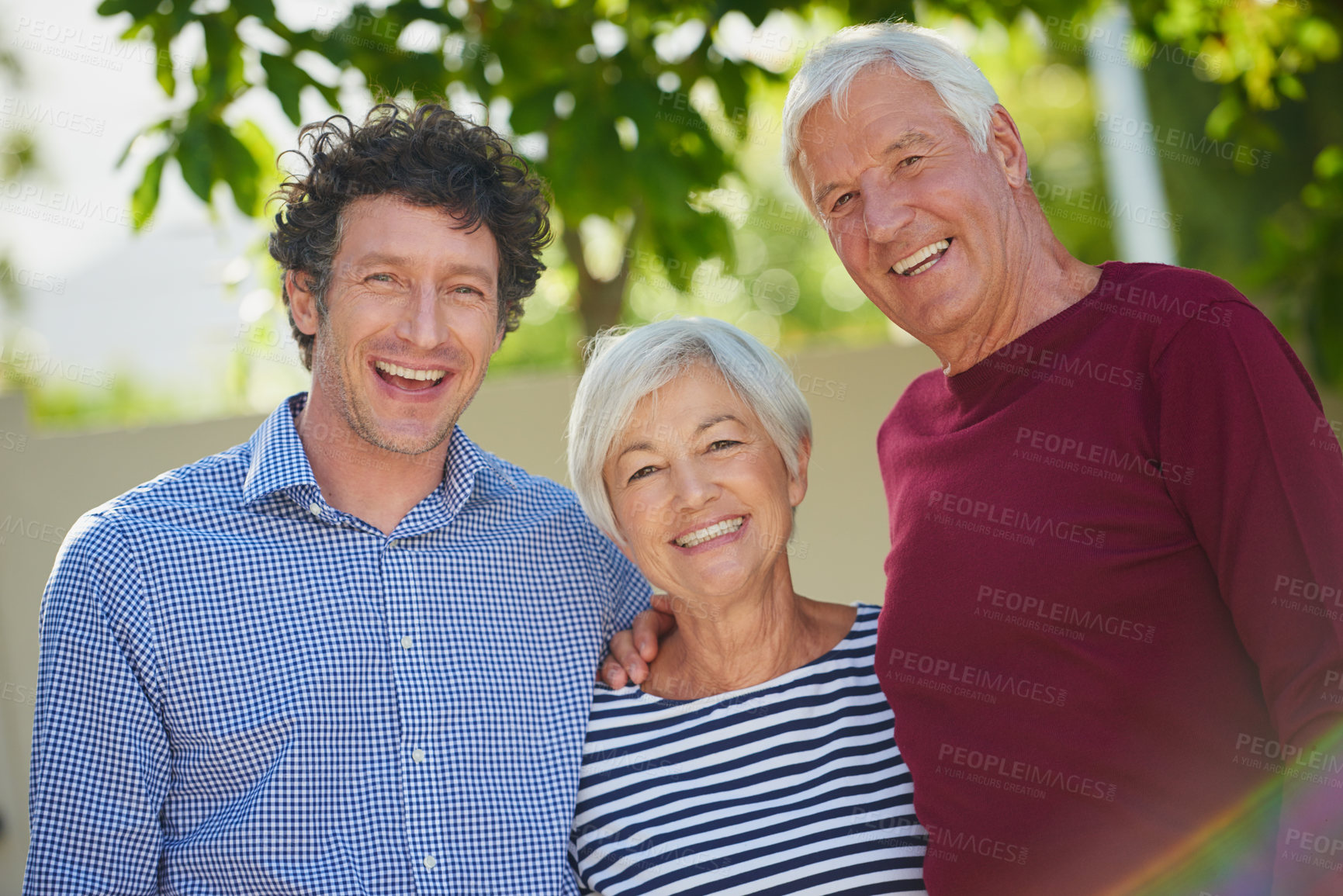 Buy stock photo Cropped portrait of a senior couple standing outside with their son