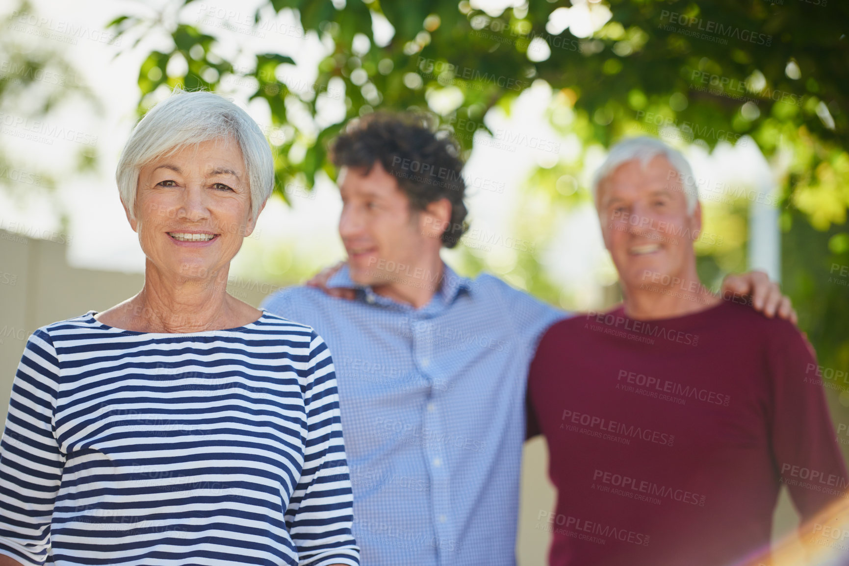 Buy stock photo Cropped portrait of a senior couple standing outside with their son