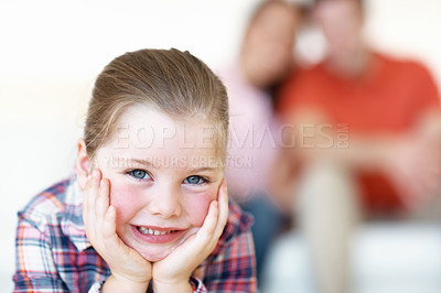Buy stock photo Closeup portrait of a young girl resting her chin on her hands
