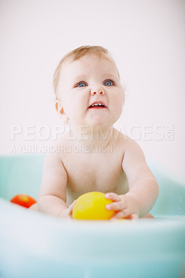 Buy stock photo An adorable baby girl enjoying her bath with her toys