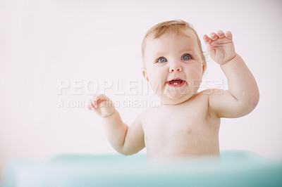 Buy stock photo A cute baby girl having fun in the bathtub