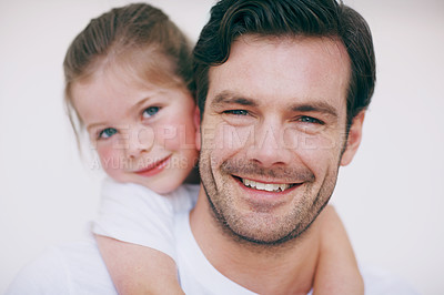 Buy stock photo Portrait of a little girl lovingly embracing her father