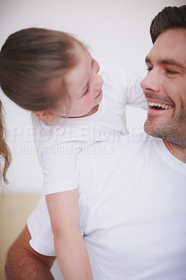 Buy stock photo A father and his young daughter being affectionate and spending quality time together