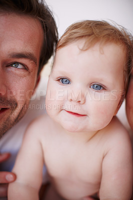 Buy stock photo Two loving young parents and their adorable baby girl