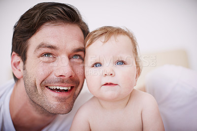 Buy stock photo Two loving young parents and their adorable baby girl