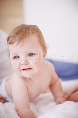 Buy stock photo Shot of a cute baby girl crawling on a bed