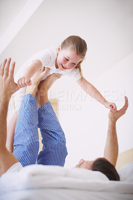 Buy stock photo An affectionate dad playing with his young daughter