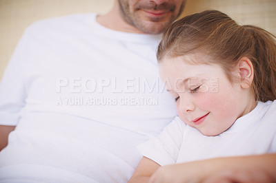 Buy stock photo Cropped view of a father siting with his young daughter while she falls asleep