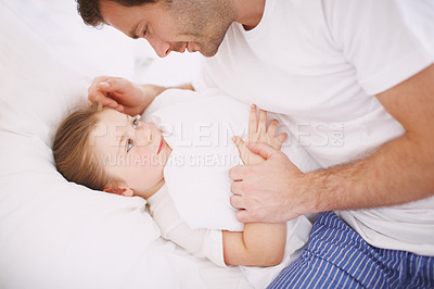 Buy stock photo A dad saying goodnight to his young daughter