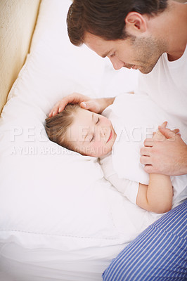 Buy stock photo A dad sitting by his daughter while she falls asleep