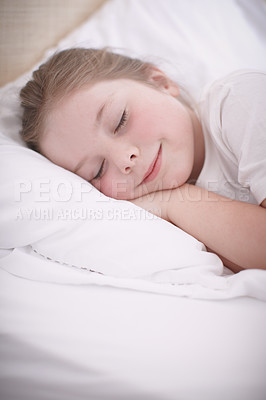 Buy stock photo A young girl sleeping peacefully in her bed