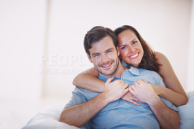Buy stock photo Portrait of a loving young couple being affectionate indoors