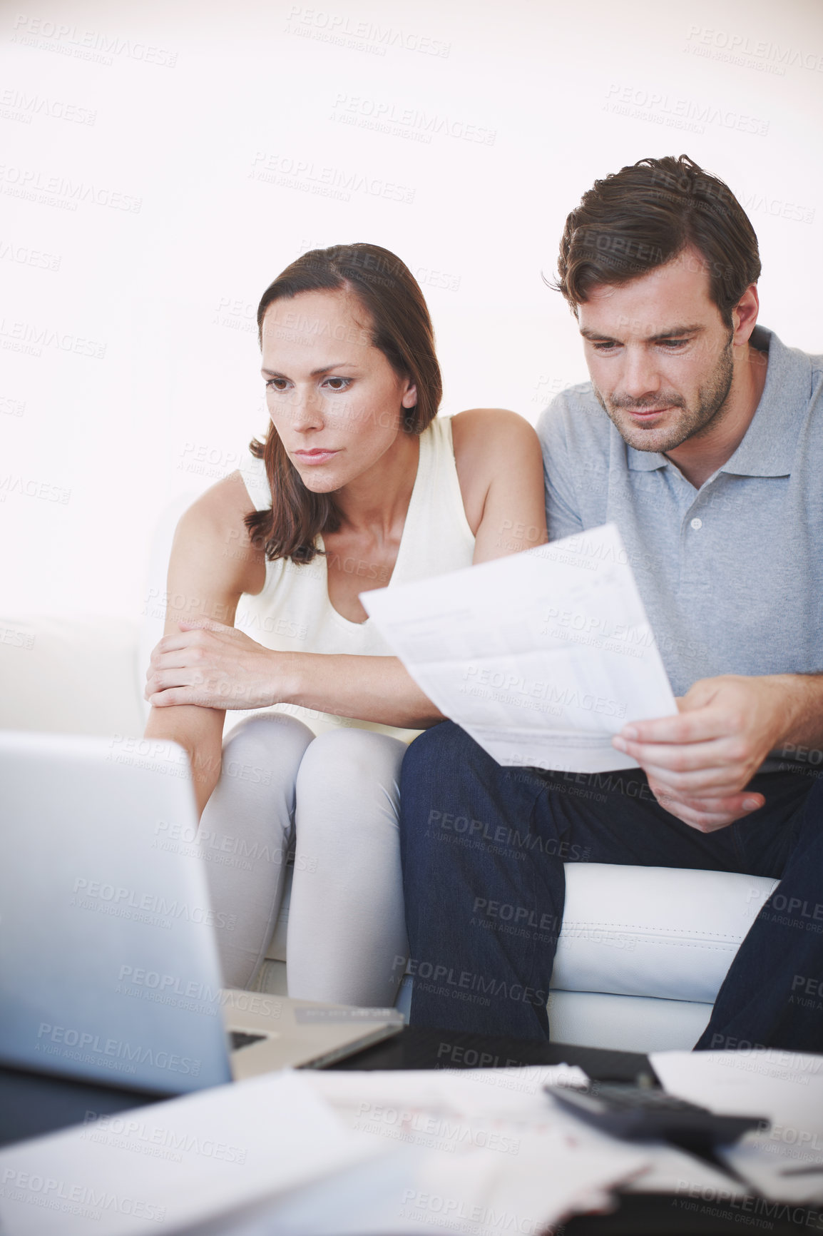 Buy stock photo A married couple doing some famliy budgeting